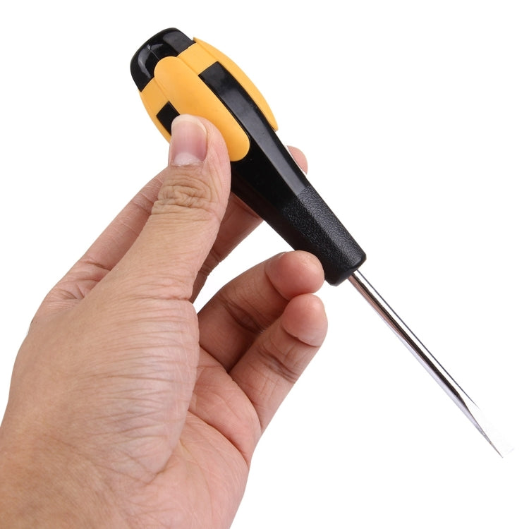 WLXY slotted screwdriver held in hand; black and orange grip, pointed tip