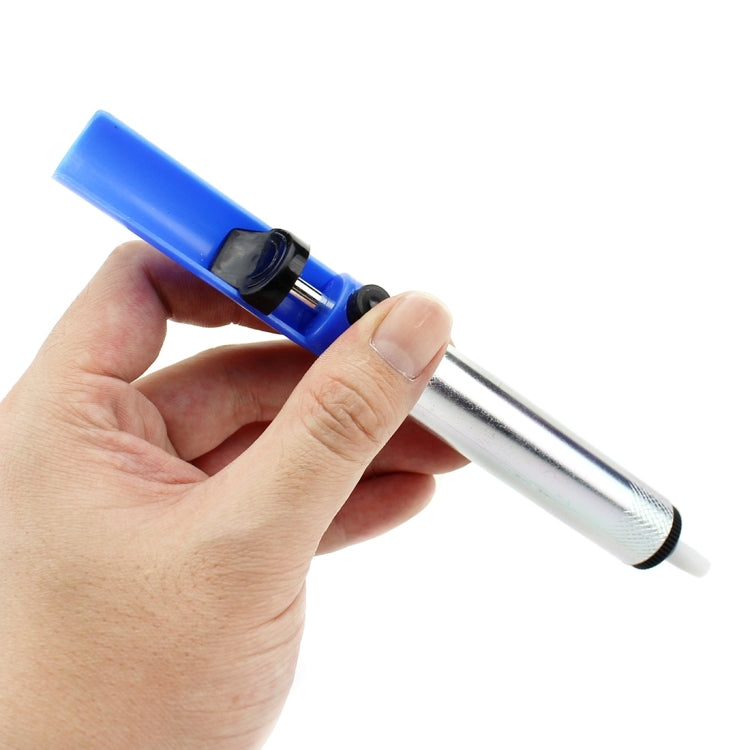Desoldering pump tool with blue head and silver mesh handle, held in hand