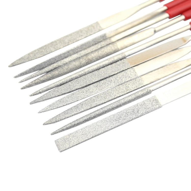 Diamond file set close-up: pointed gray abrasive tips on metal shafts with red grips