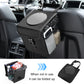 Black foldable car trash can with round lid, side mesh pocket, and hanging strap