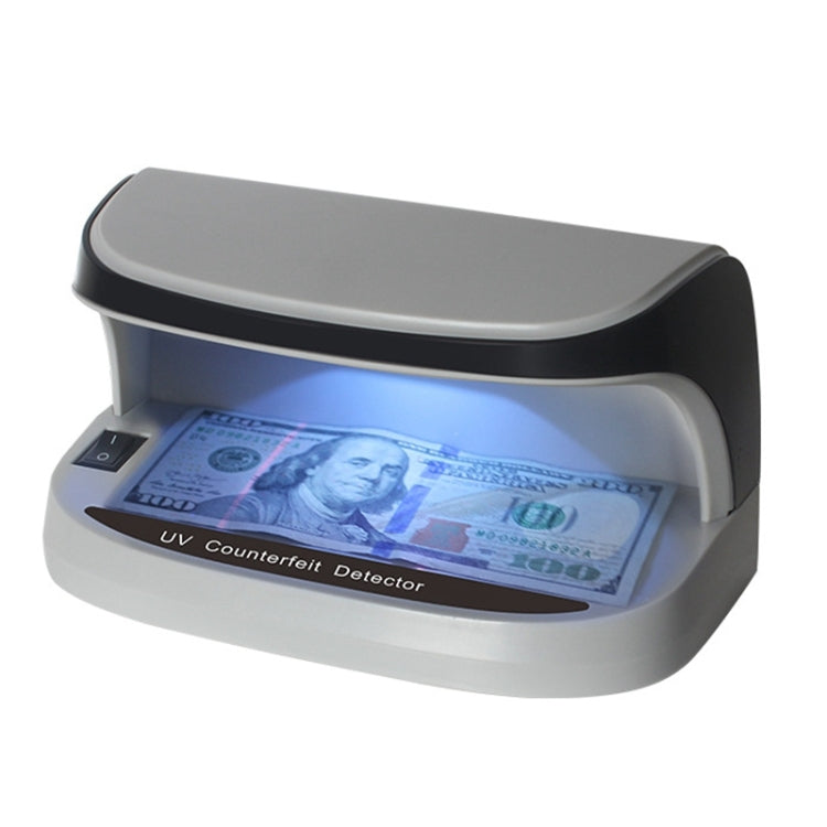 LED UV money detector with open tray, blue light showing UV check on banknote