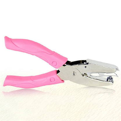 Manual hole punch with pink plastic handles and silver metal jaw, single puncher tool