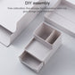 Grey-white desktop storage box with open compartments and modular insert
