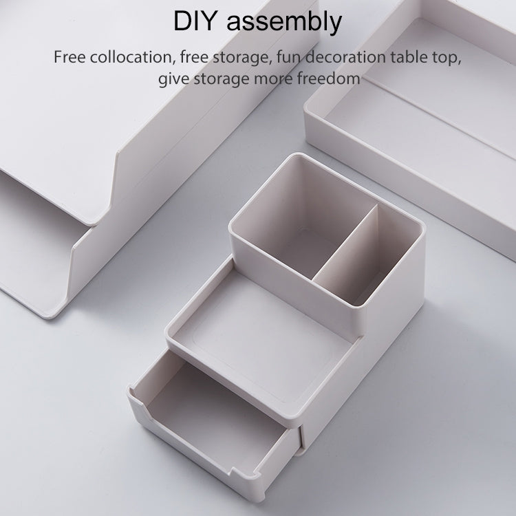 Grey-white desktop storage box with open compartments and modular insert