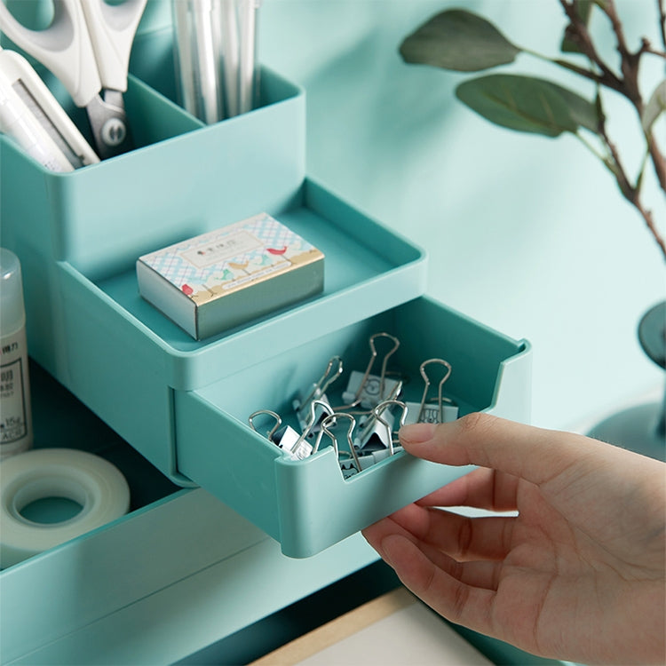 Teal blue-green removable tray storage box with hand placing small metal clips