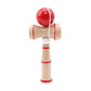 Wooden kendama skill toy with red ball, red-striped wooden handle, and extra string loop