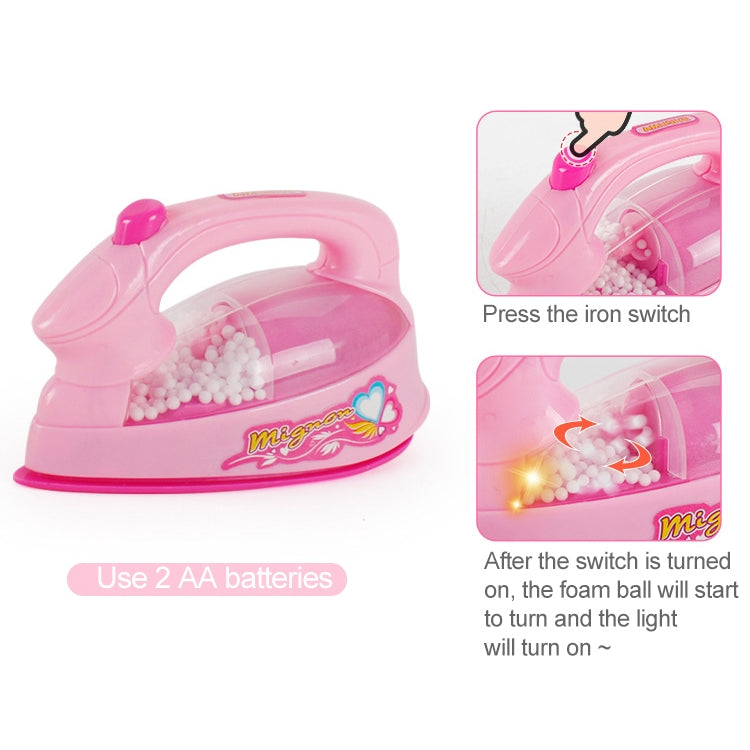 Pink plastic pretend iron toy with clear chamber and top switch detail