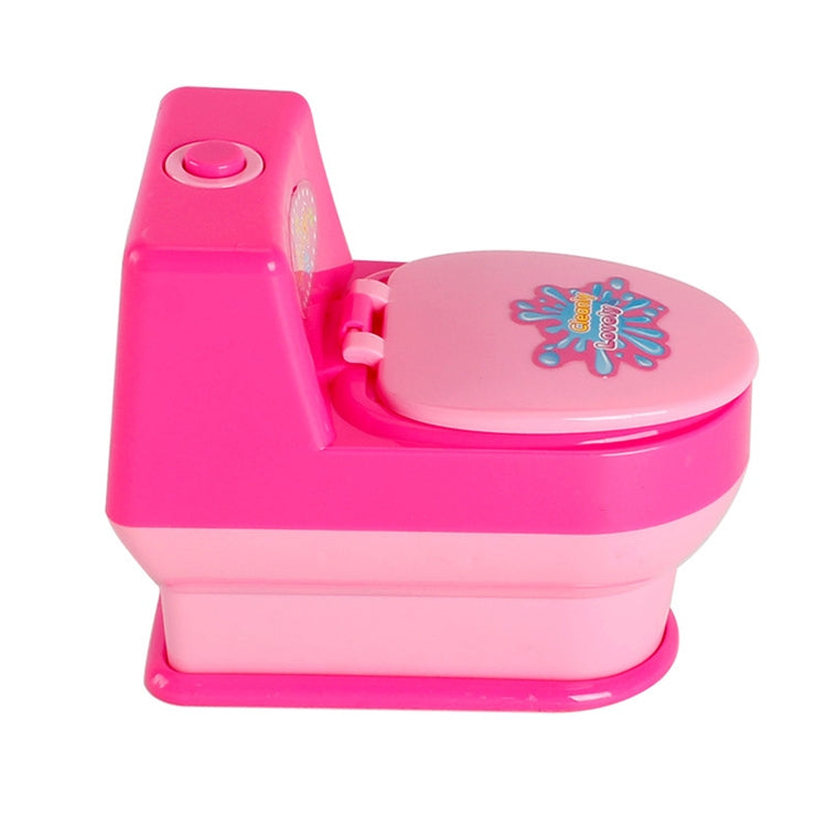 Pink mini pretend toilet toy with rounded seat lid and raised side control panel