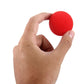 Hand holding a red sponge magic ball
