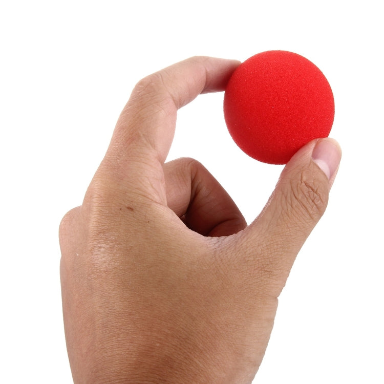Hand holding a red sponge magic ball
