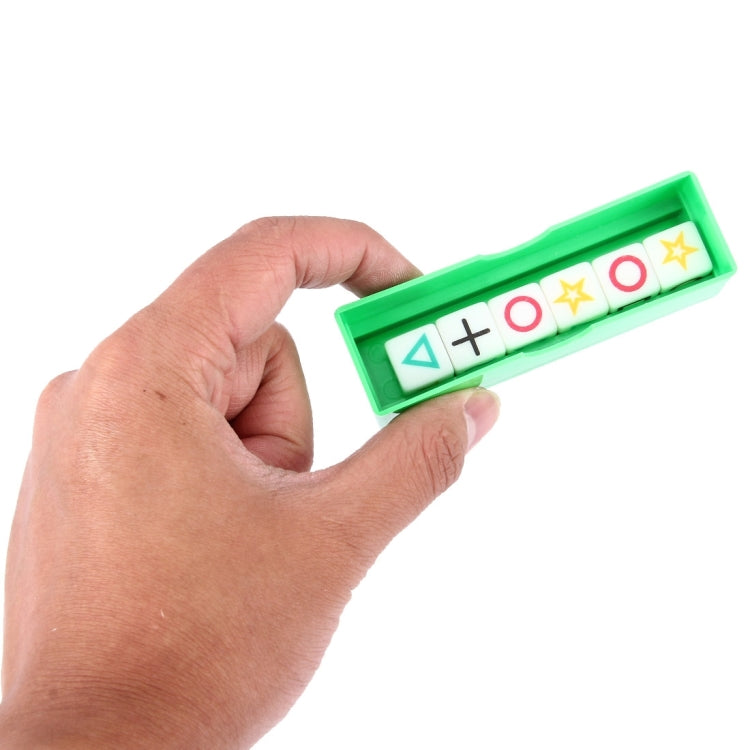 Hand holding green magic dice prop strip with symbol cards and plus signs
