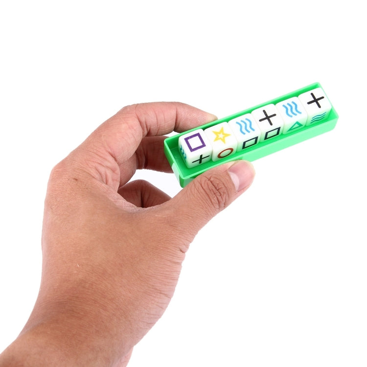 Hand holding green magic dice prop strip showing square, star, and wave icons