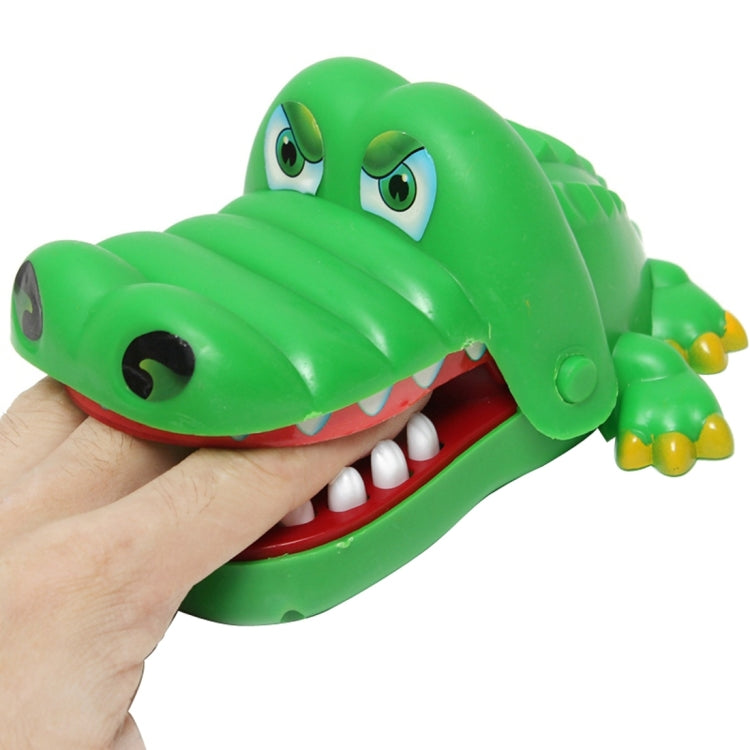 Green crocodile bite toy with open mouth, showing white teeth and large eyes