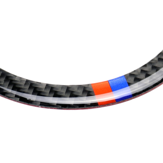 Carbon-fiber steering wheel trim edge with red and blue accent bands