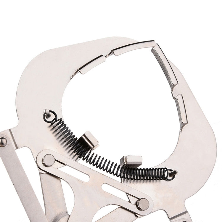 Close-up of silver piston ring plier with spring mechanism and curved jaw supports