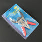 Piston ring compressor tool set in blister pack with red handles