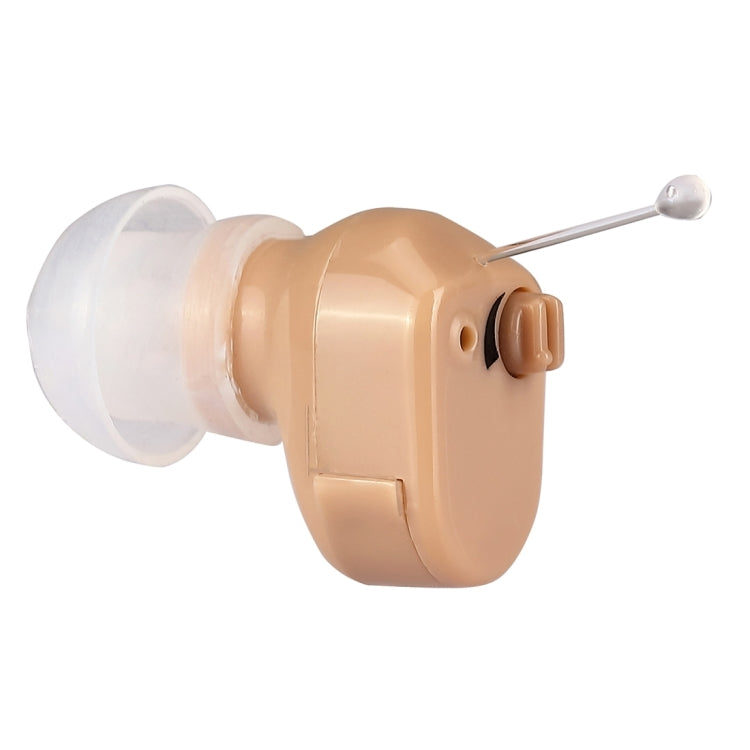 Beige mini in-ear hearing aid with clear earpiece tube and silver tip