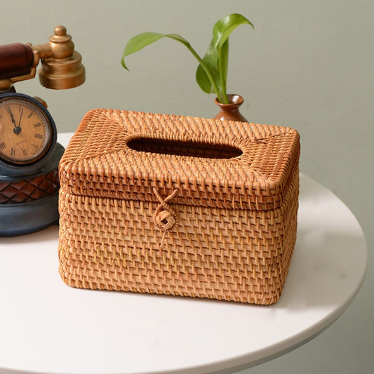 Square woven rattan tissue box with top slot opening and front tied cord detail