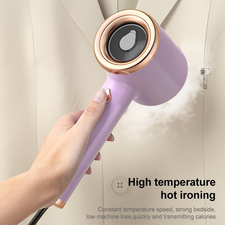 Light purple handheld garment steamer held in hand with steam vent at the front