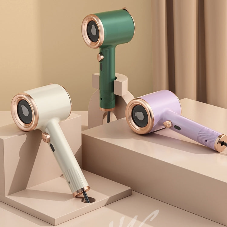 Handheld garment steamers in green, purple, and white with round steam heads