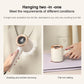 Handheld garment steamer steaming clothing and ironing on a flat surface