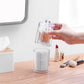 Transparent round plastic container with domed lid, holding cotton swabs