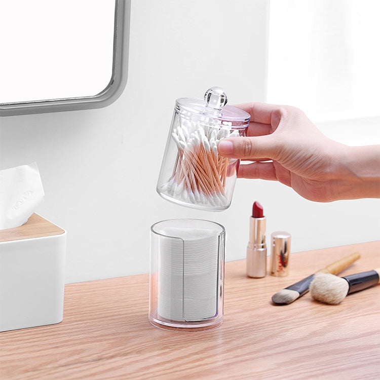 Transparent round plastic container with domed lid, holding cotton swabs