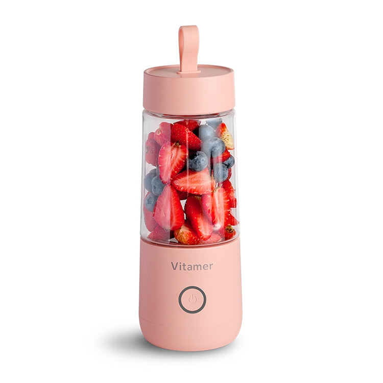 Pink portable USB mini juicer blender bottle with fruit inside and on/off button