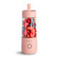 Pink portable USB mini juicer blender bottle with mixed berries in the cup
