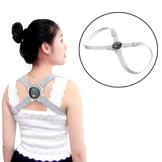 Grey anti-hunchback posture correction strap with central vibration sensor module, worn on back