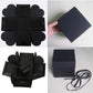 Folded black photo explosion album pieces with ribbon and empty panel squares