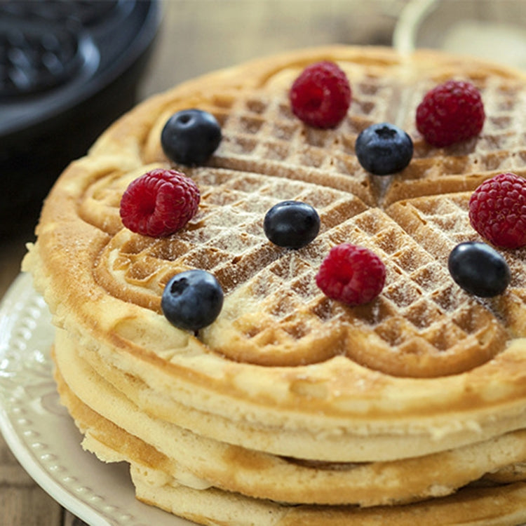 Stack of golden waffles with deep grid pattern for mini waffle maker baking