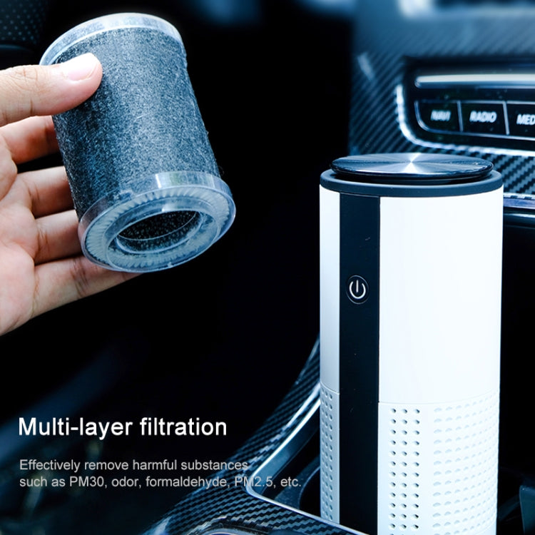Cylindrical car air purifier with vent holes and visible filter cartridge