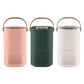Set of portable air purifiers in pink, green, and white with carrying handles
