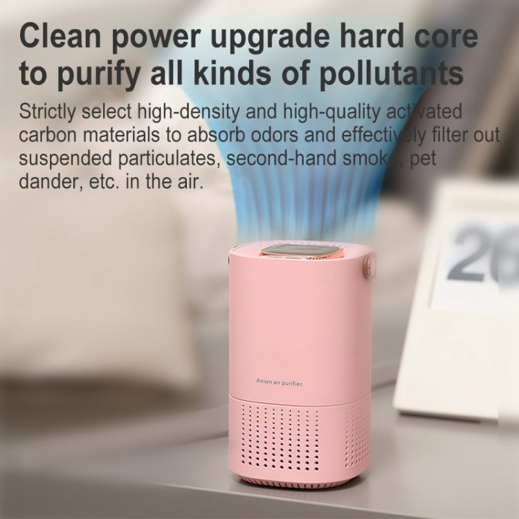 Pink portable air purifier on countertop with top display and brown handle