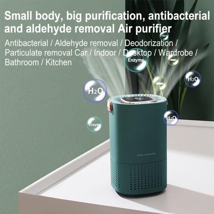 Green portable air purifier on countertop with top display and brown handle