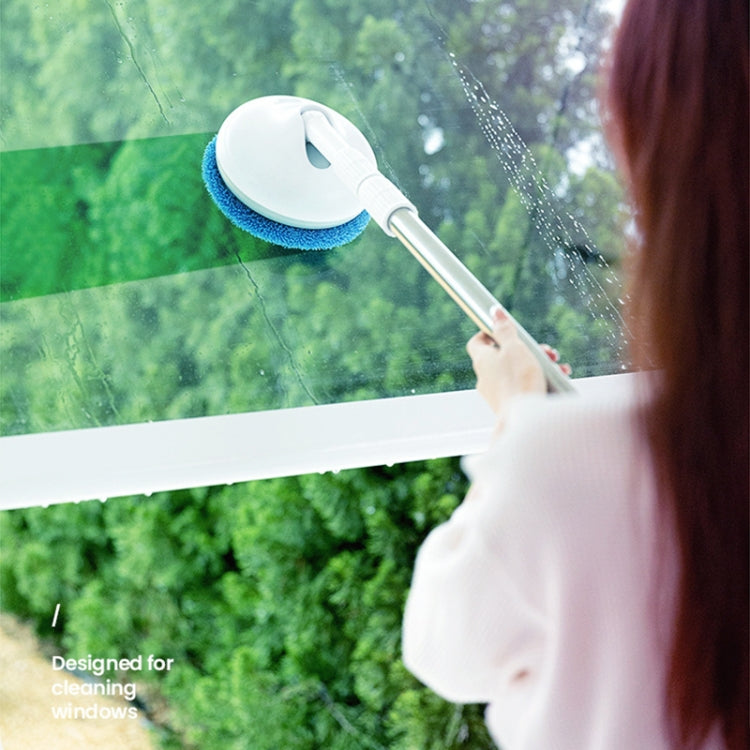 Telescopic electric window cleaner spraying and scrubbing glass surface with blue brush