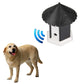 Outdoor bark control training house with sound-wave indicator beside a standing dog