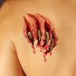 Temporary wound scar tattoo on skin: red burn marks with green veins and dripping blood