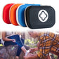 Set of portable first aid kit cases in red, orange, blue, and black with cross logos