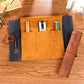 Tan stationery pencil bag with compartments, dark pocket, rolled pencil case