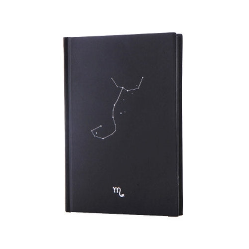 Black cover paper notebook with constellation diagram and zodiac icon near bottom