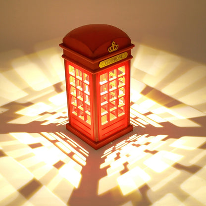 Red rechargeable phone booth bedside lamp with glowing grid windows and crown top.