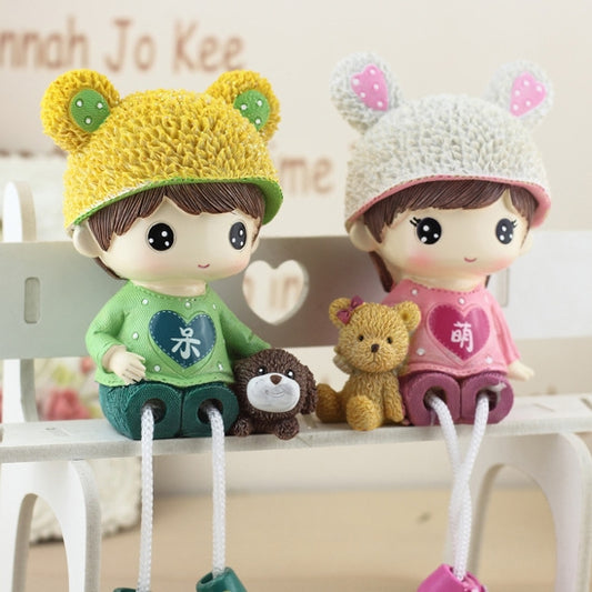 Couple hanging doll ornaments: bear-hat boys in green and pink outfits, with teddy plush