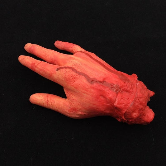 Bloody four-finger fake hand prop, red plastic with smeared gore detail.