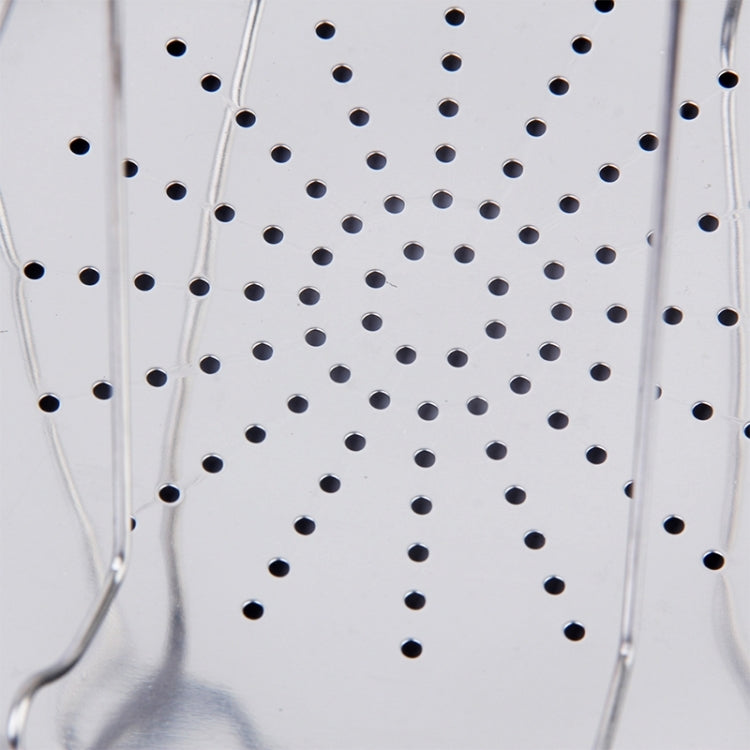 Close-up of perforated stainless steel toast tray with small round drainage holes