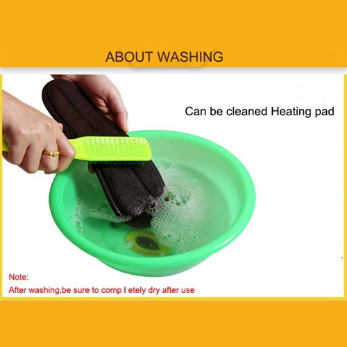 Hand cleaning the black heating pad of heated insoles in a basin