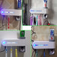 Wall-mounted UV toothbrush sterilizer dispenser with blue sanitizer light