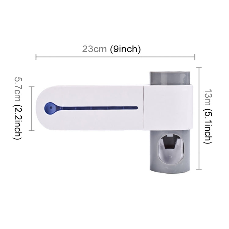 Automatic toothpaste dispenser with UV light bar and toothbrush holder, labeled dimensions