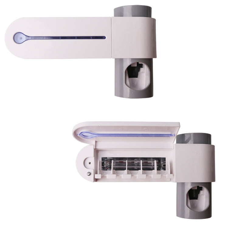 Automatic toothpaste dispenser with UV sterilizer housing and toothbrush rack compartment
